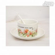 Mažas puodelis su lėkštute ir užrašu, Ačiū, kad padedate mums augti